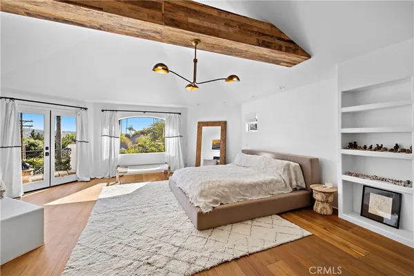a bedroom with a bed and a couch