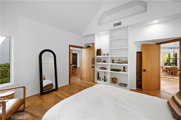 a bedroom with a bed and a fireplace