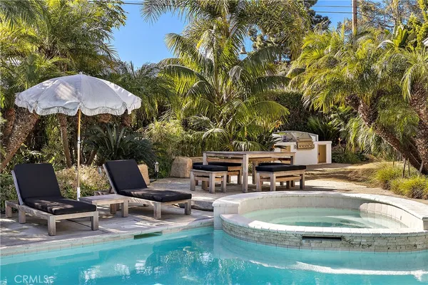 a view of a swimming pool with a patio