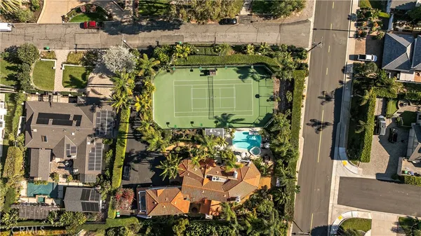 an aerial view of a residential apartment building with a yard