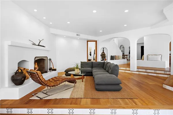 a living room with furniture and a fireplace