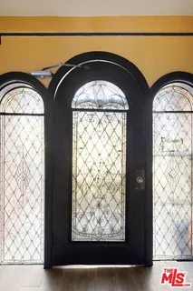 a front view of a building with parking space