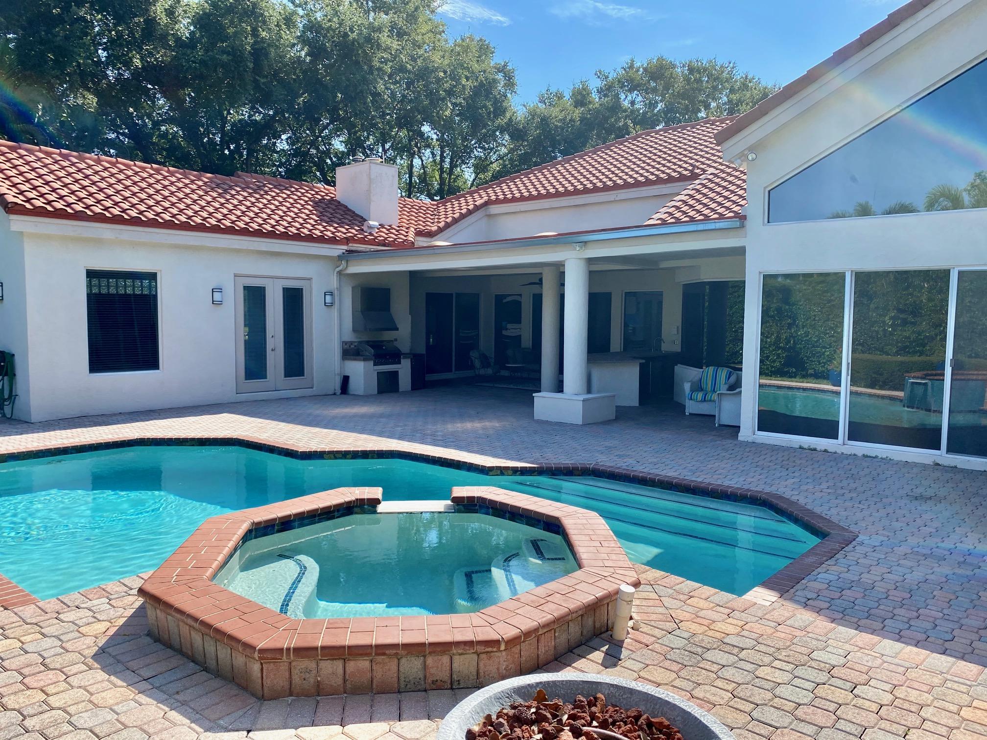 1605 Southwest 20th Avenue Boca Raton, FL 33486 - Photo 11 of 70 a view of a house with a swimming pool and porch