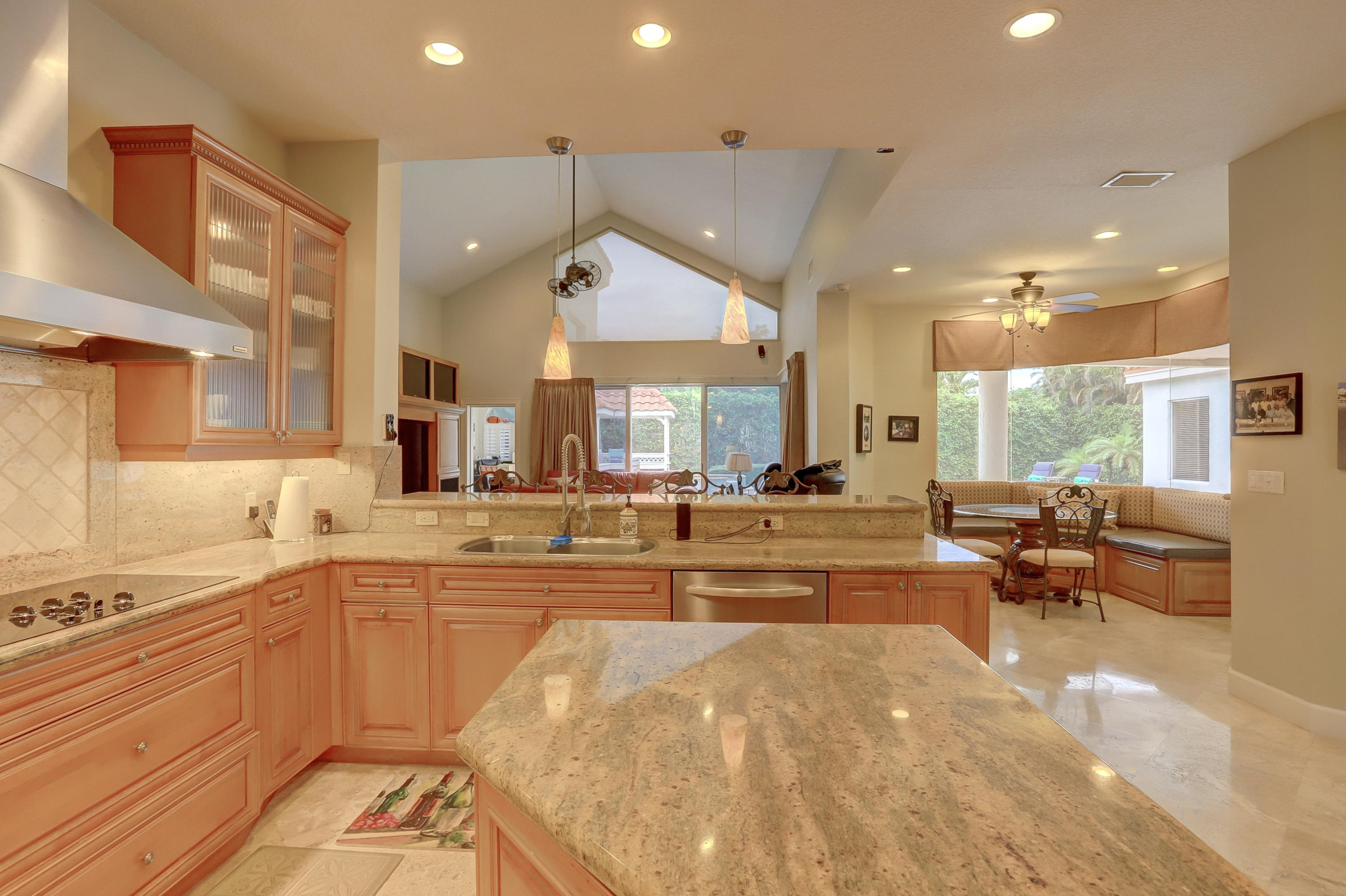 1605 Southwest 20th Avenue Boca Raton, FL 33486 - Photo 15 of 70 a large kitchen with lots of counter top space and living room