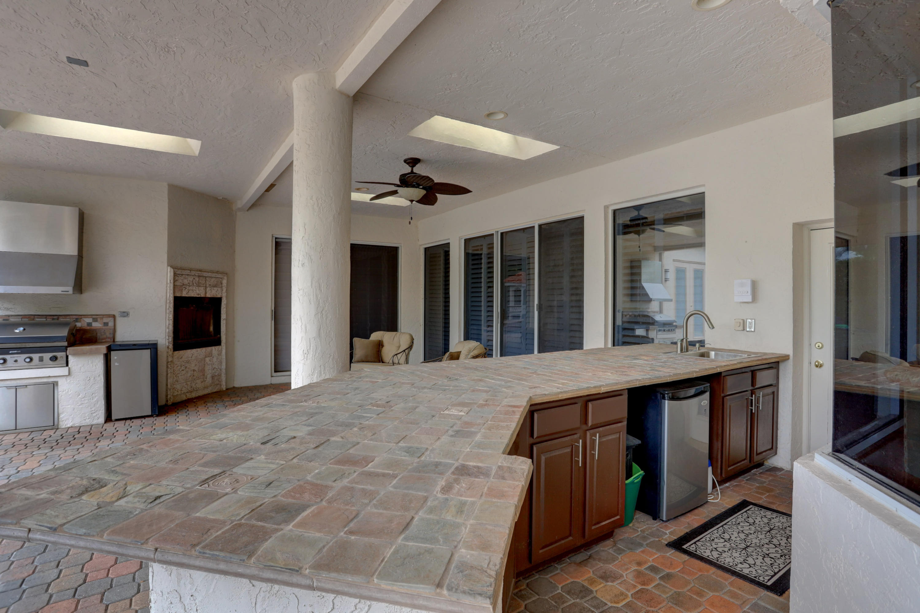1605 Southwest 20th Avenue Boca Raton, FL 33486 - Photo 23 of 70 a large kitchen with kitchen island a sink stainless steel appliances and cabinets