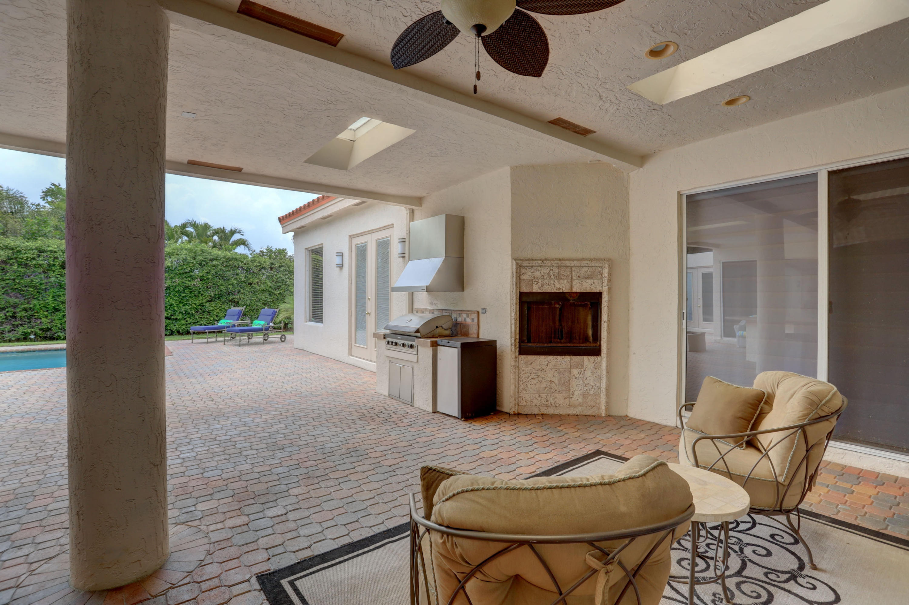 1605 Southwest 20th Avenue Boca Raton, FL 33486 - Photo 25 of 70 a living room with furniture and a fireplace
