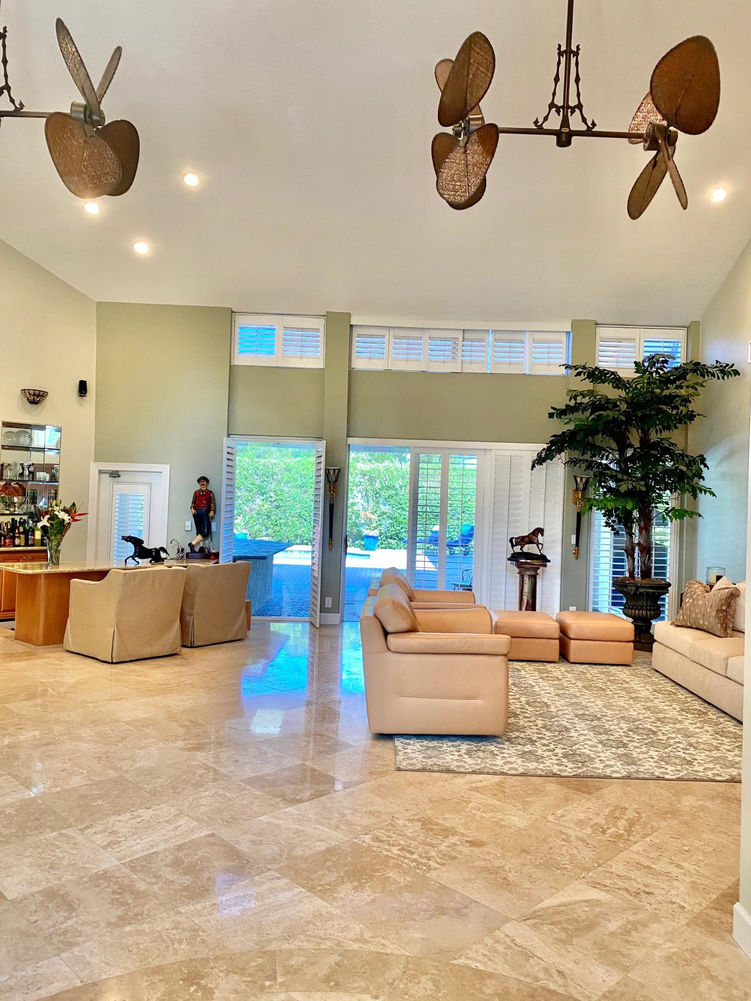 1605 Southwest 20th Avenue Boca Raton, FL 33486 - Photo 3 of 70 a living room with furniture and a chandelier