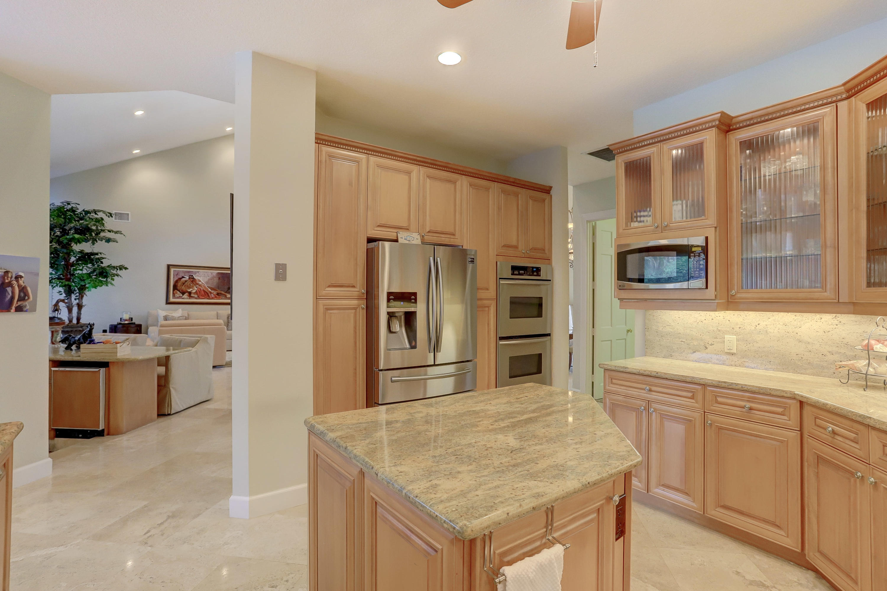 1605 Southwest 20th Avenue Boca Raton, FL 33486 - Photo 30 of 70 a kitchen with a refrigerator a sink and a stove
