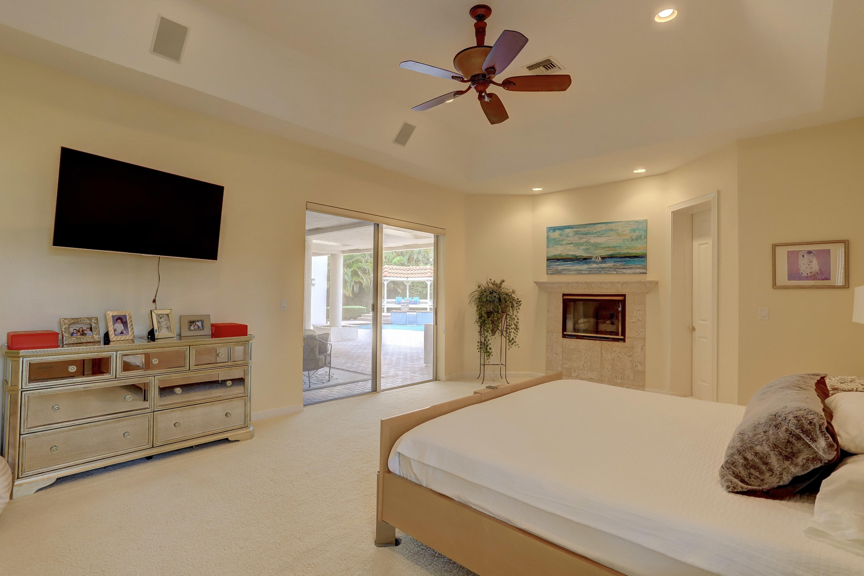 1605 Southwest 20th Avenue Boca Raton, FL 33486 - Photo 33 of 70 a bedroom with a bed and a flat screen tv
