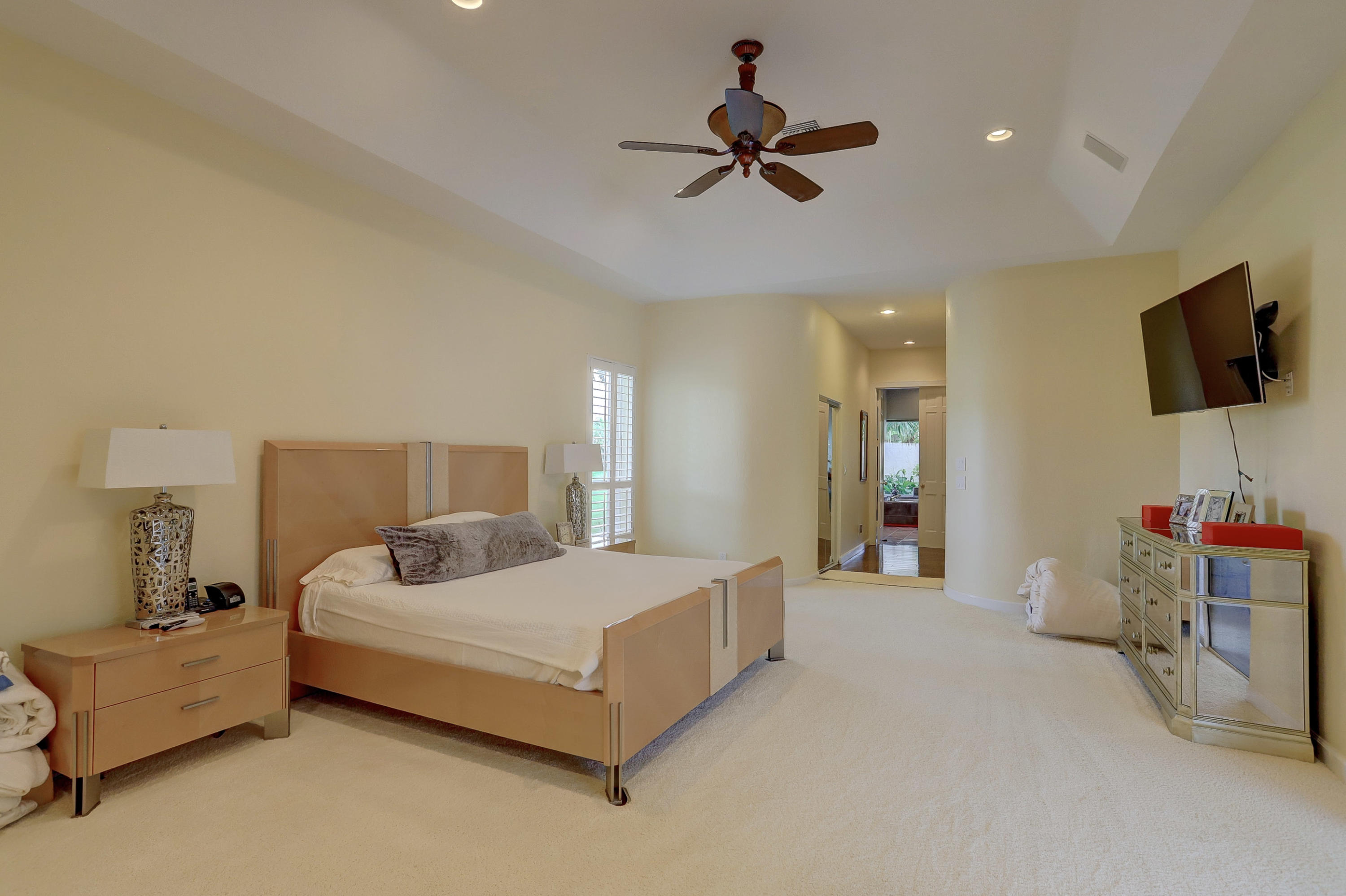 1605 Southwest 20th Avenue Boca Raton, FL 33486 - Photo 35 of 70 a bedroom with a bed and a flat screen tv