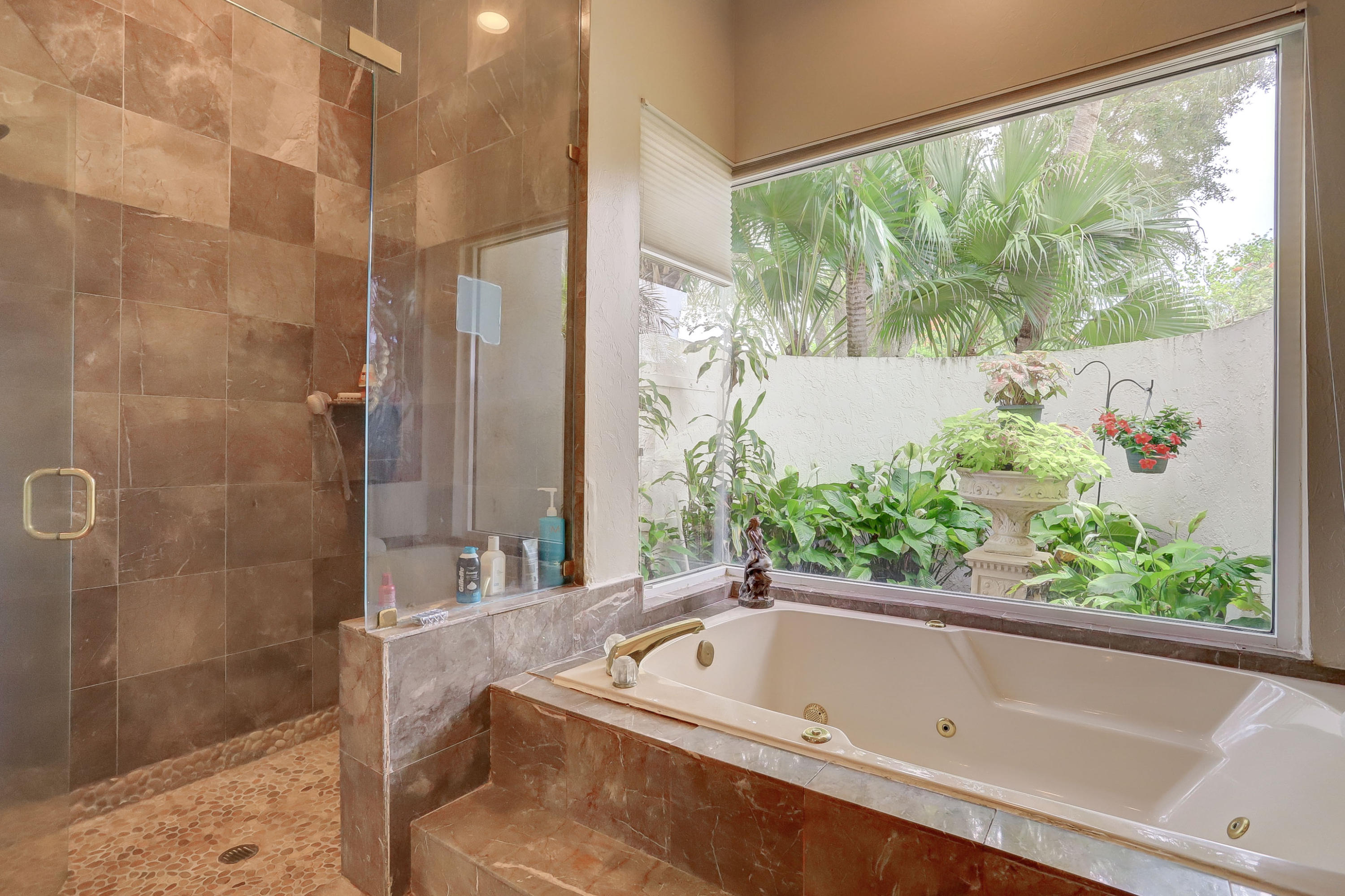 1605 Southwest 20th Avenue Boca Raton, FL 33486 - Photo 36 of 70 a bath tub sitting in front of a bathtub