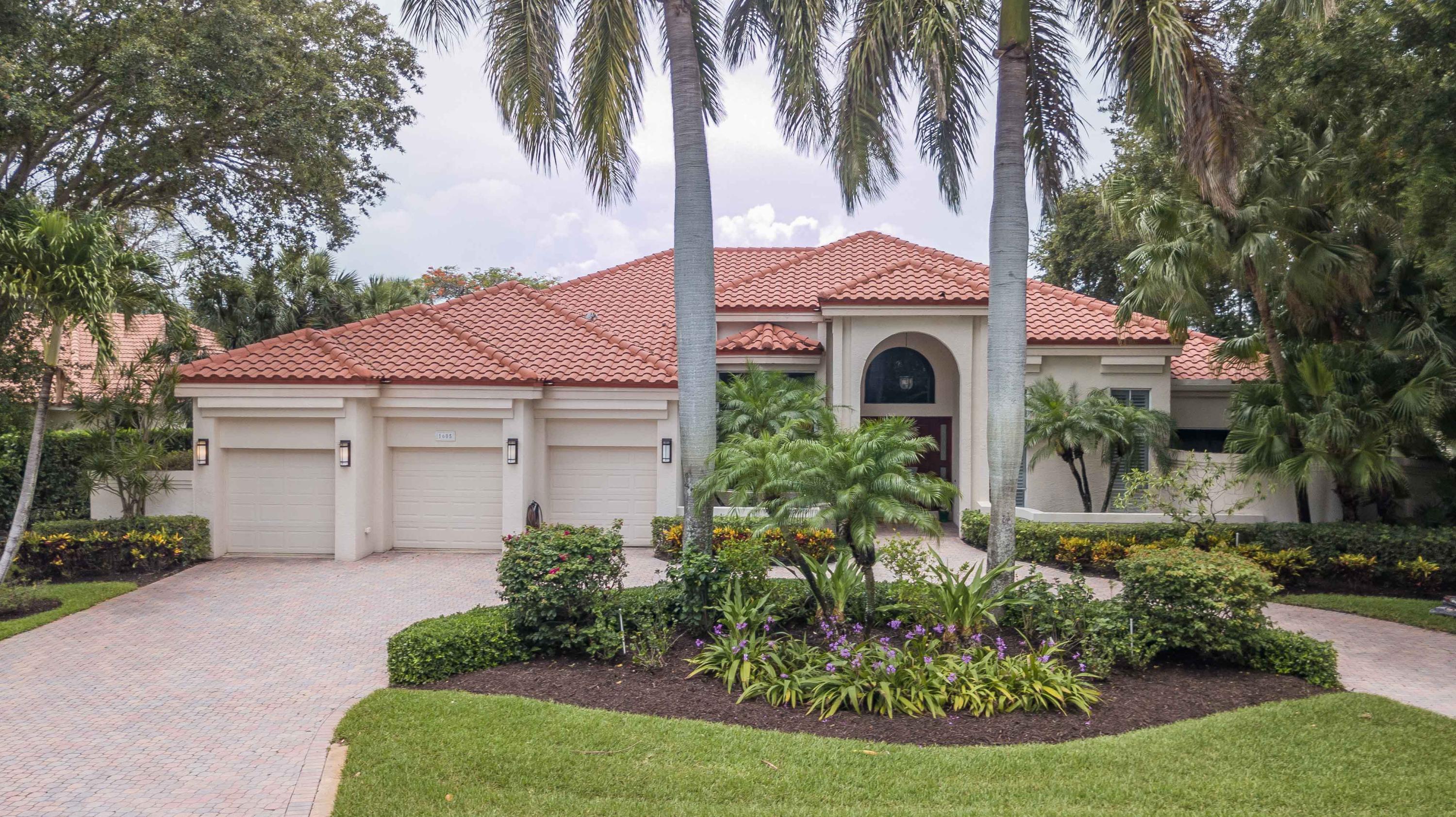 1605 Southwest 20th Avenue Boca Raton, FL 33486 - Photo 4 of 70 a front view of a house with garden