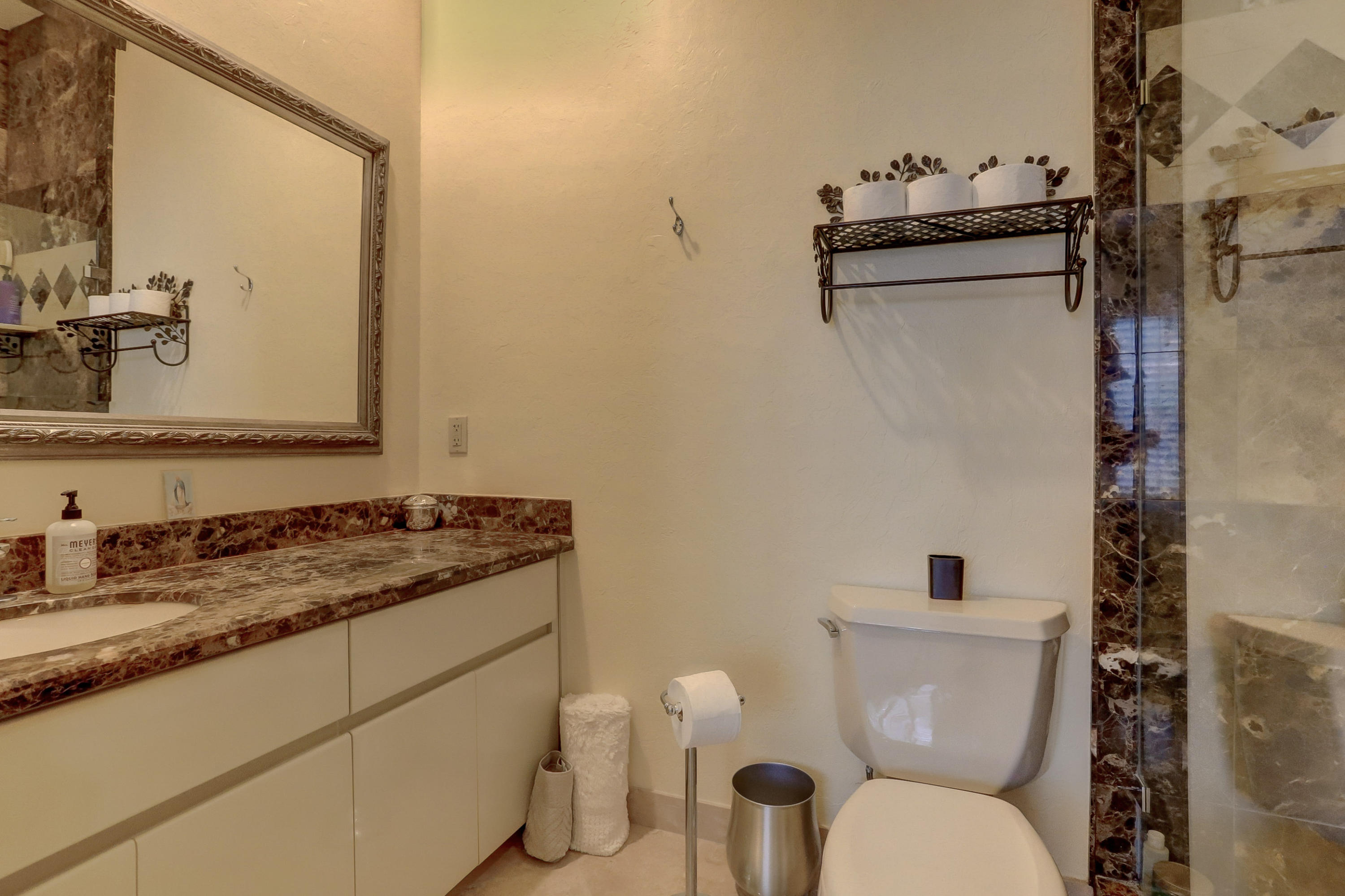1605 Southwest 20th Avenue Boca Raton, FL 33486 - Photo 41 of 70 a white toilet sitting next to a bathroom sink