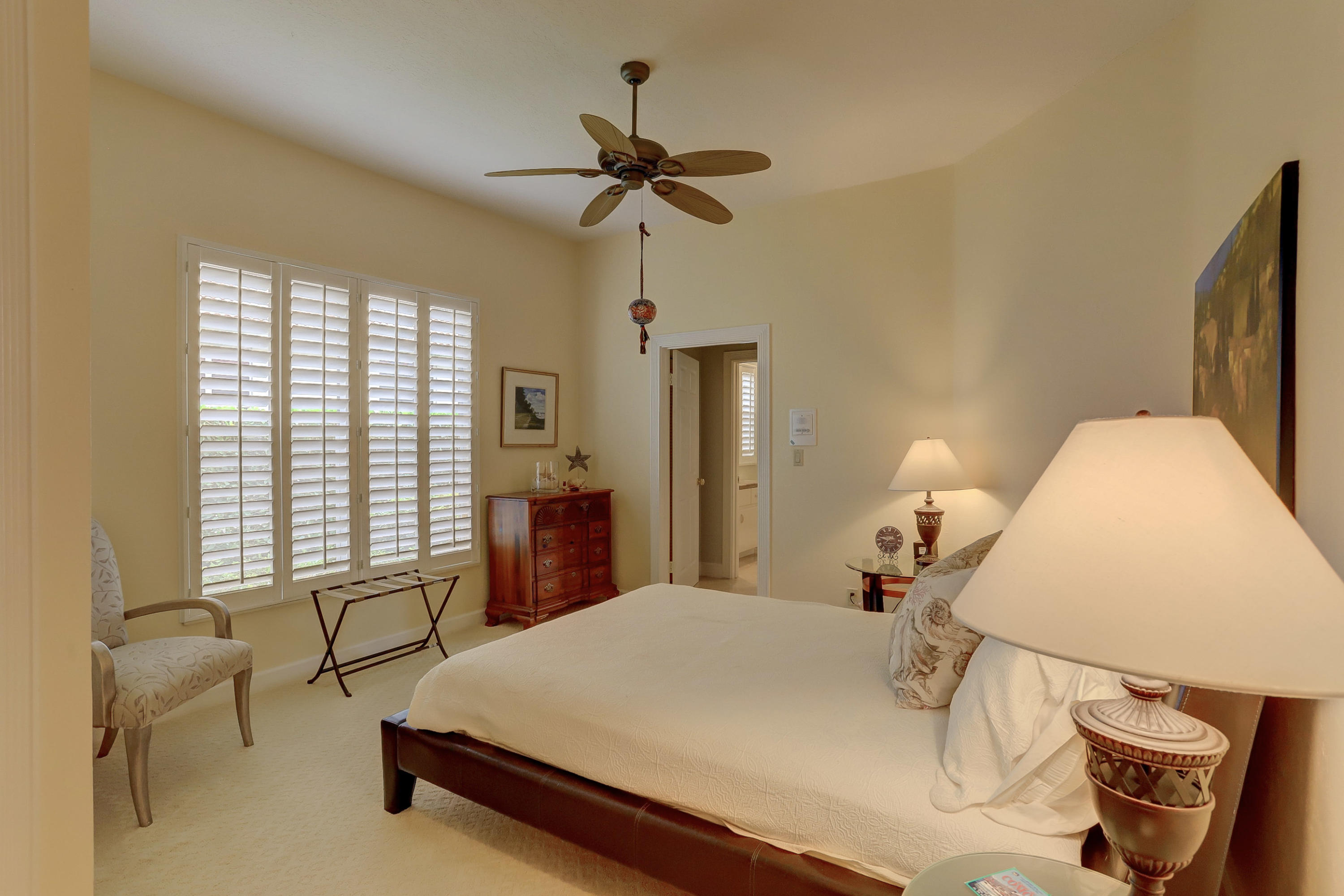 1605 Southwest 20th Avenue Boca Raton, FL 33486 - Photo 46 of 70 a bed room with a bed and a chandelier