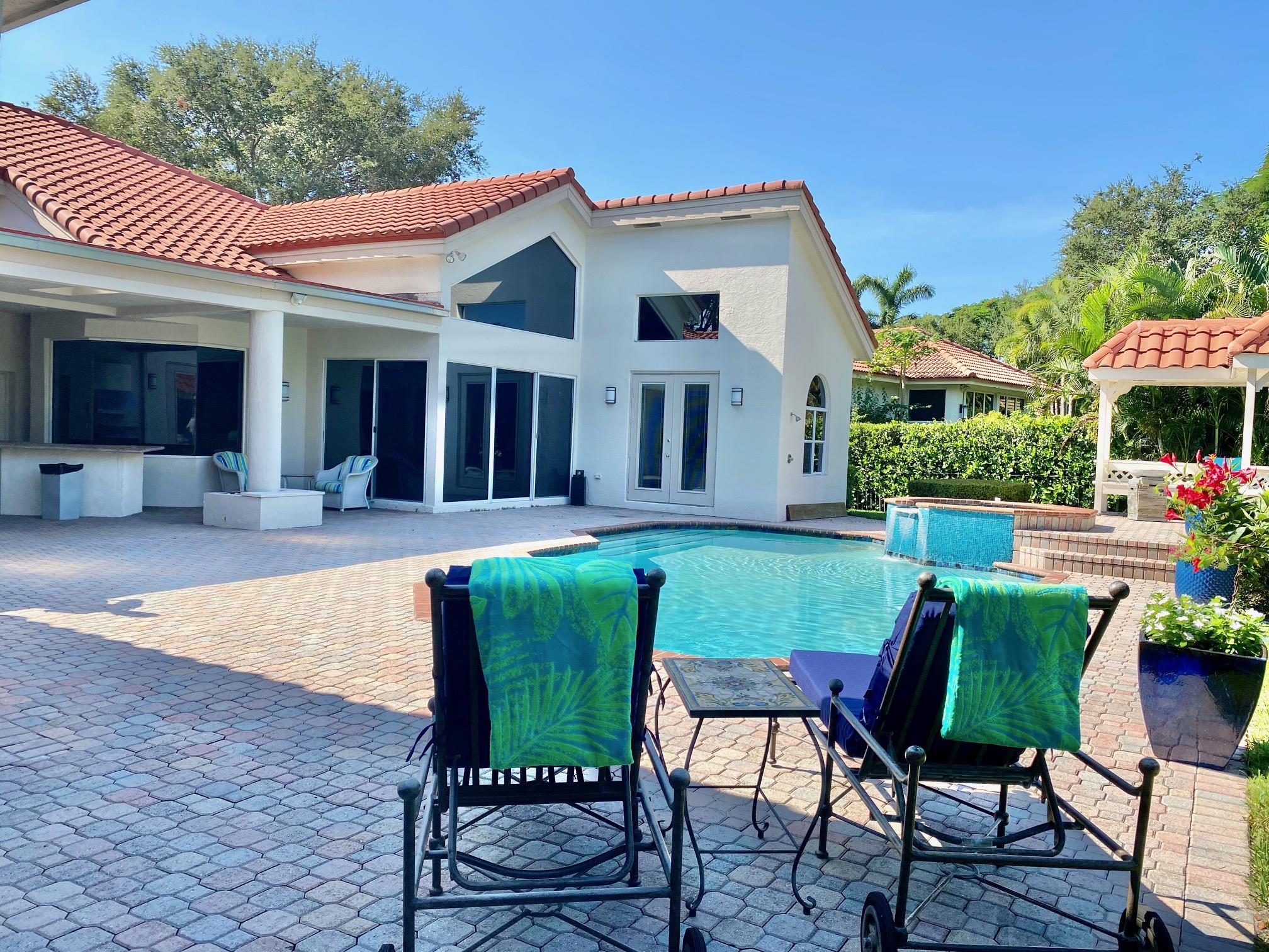 1605 Southwest 20th Avenue Boca Raton, FL 33486 - Photo 5 of 70 a view of a house with a swimming pool and sitting area