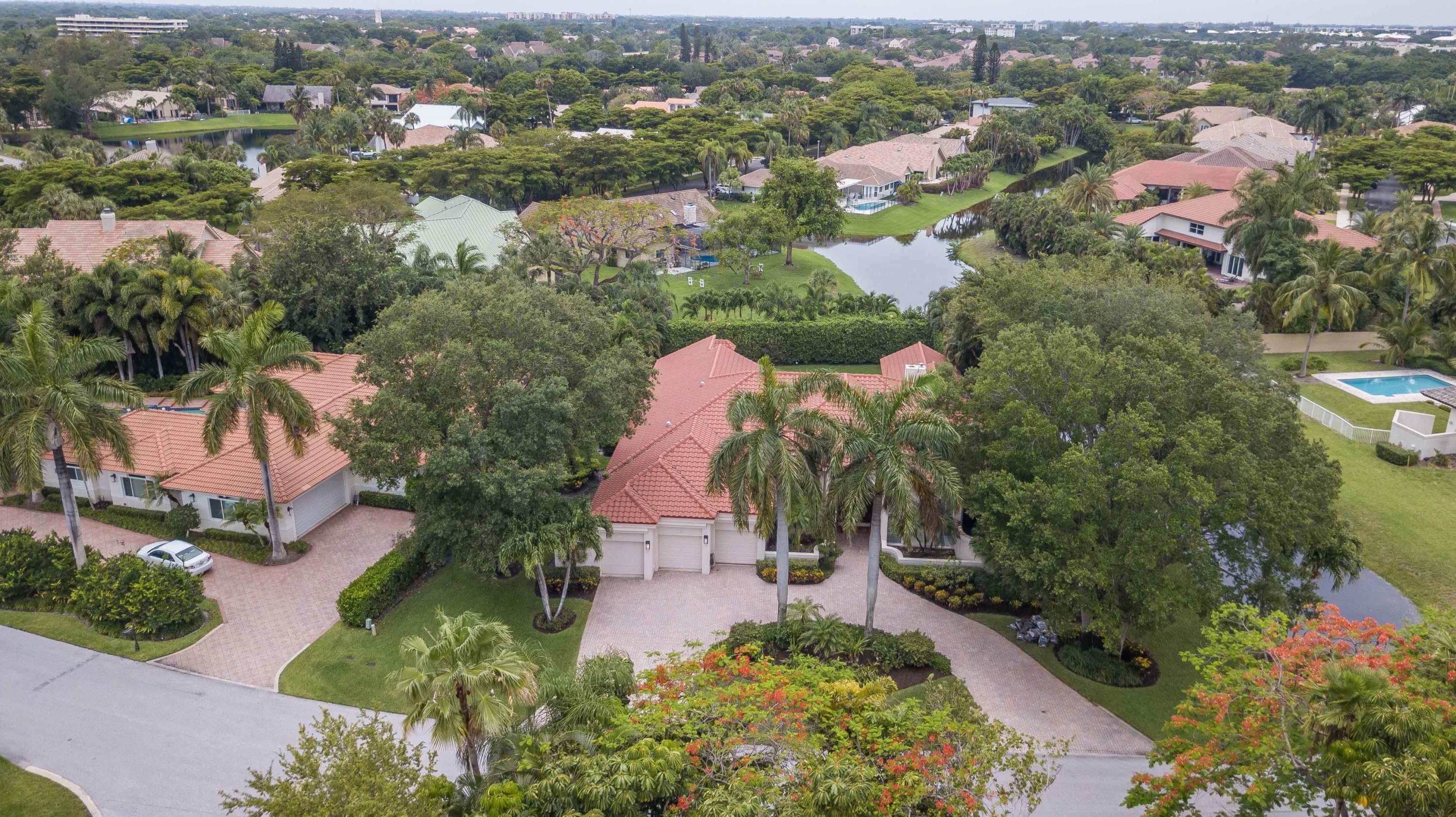 1605 Southwest 20th Avenue Boca Raton, FL 33486 - Photo 56 of 70 an aerial view of residential houses with outdoor space and trees