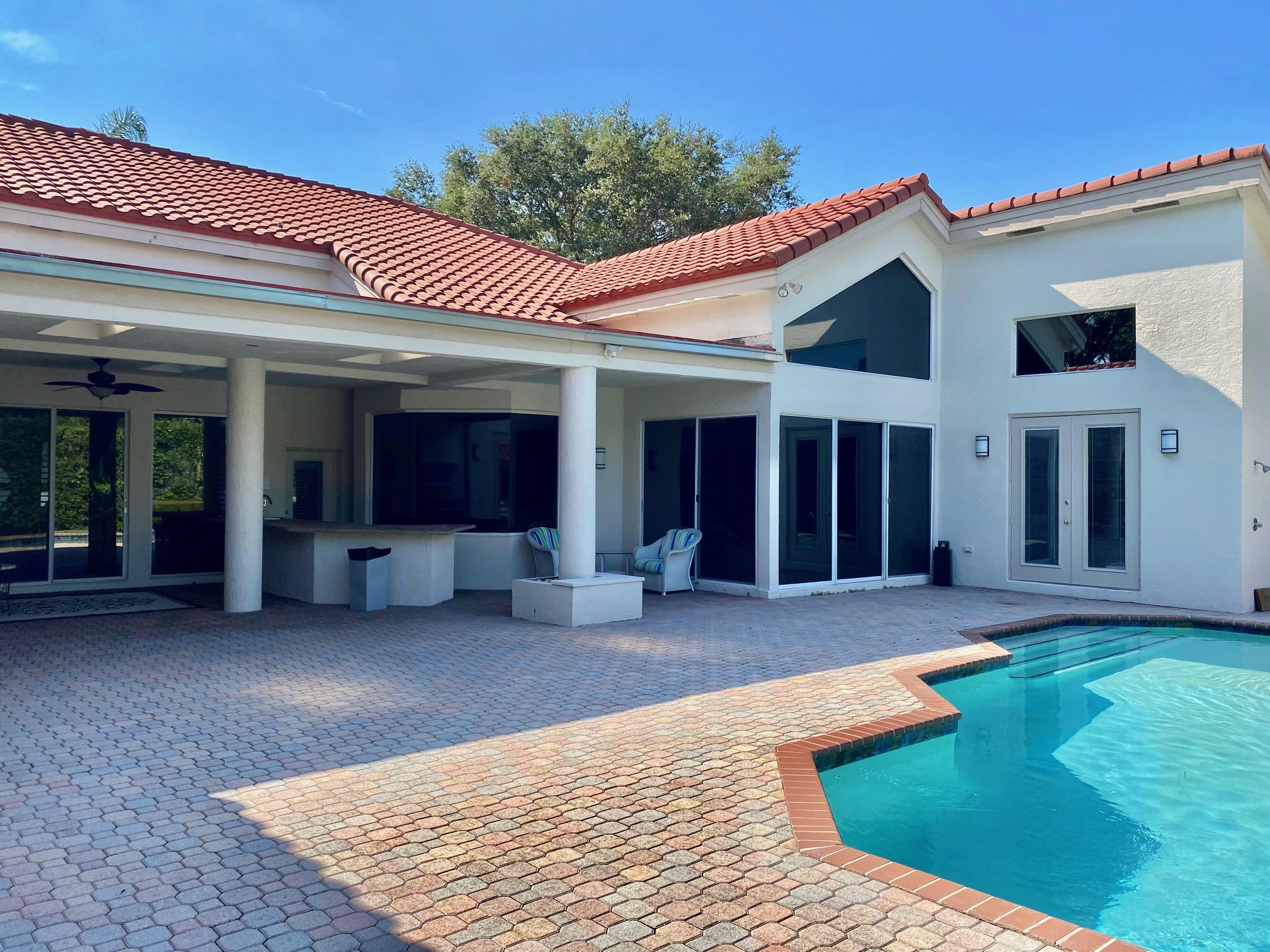 1605 Southwest 20th Avenue Boca Raton, FL 33486 - Photo 62 of 70 a view of a house with a yard and sitting area