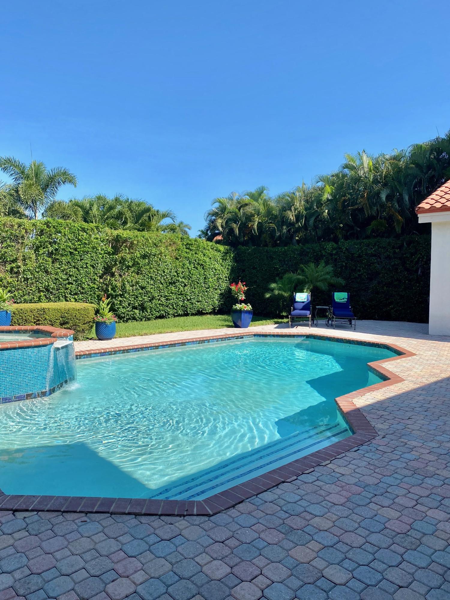 1605 Southwest 20th Avenue Boca Raton, FL 33486 - Photo 67 of 70 a view of a swimming pool with a yard