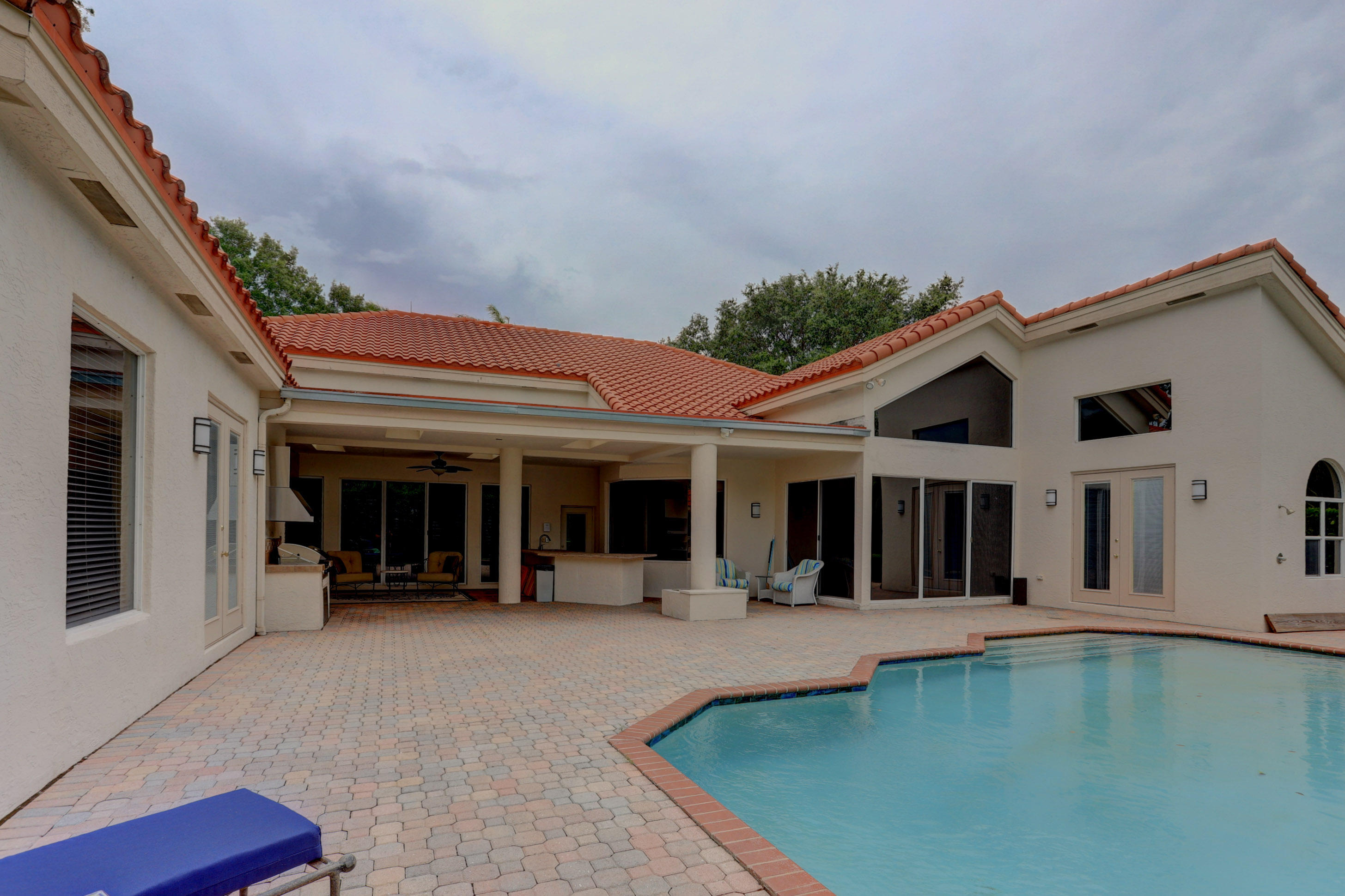 1605 Southwest 20th Avenue Boca Raton, FL 33486 - Photo 69 of 70 a view of a white house with swimming pool and porch