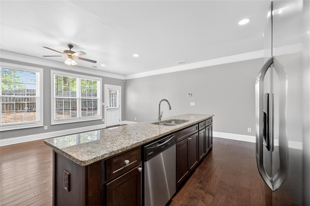 2854 Jordan Oaks Lane, Unit 8 Decatur, GA 30033 - Photo 11 of 41 a kitchen with stainless steel appliances granite countertop a sink window and refrigerator