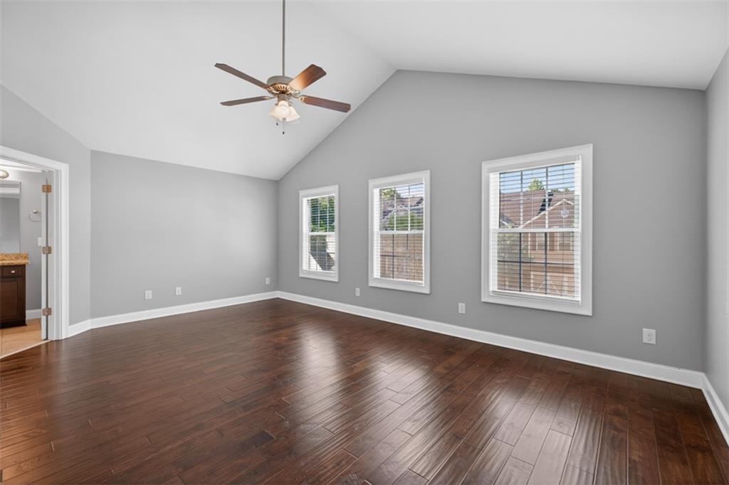 2854 Jordan Oaks Lane, Unit 8 Decatur, GA 30033 - Photo 17 of 41 a view of an empty room with wooden floor and a window