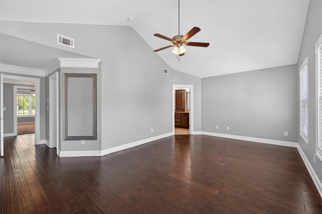 2854 Jordan Oaks Lane, Unit 8 Decatur, GA 30033 - Photo 18 of 41 a view of an empty room with wooden floor and a window