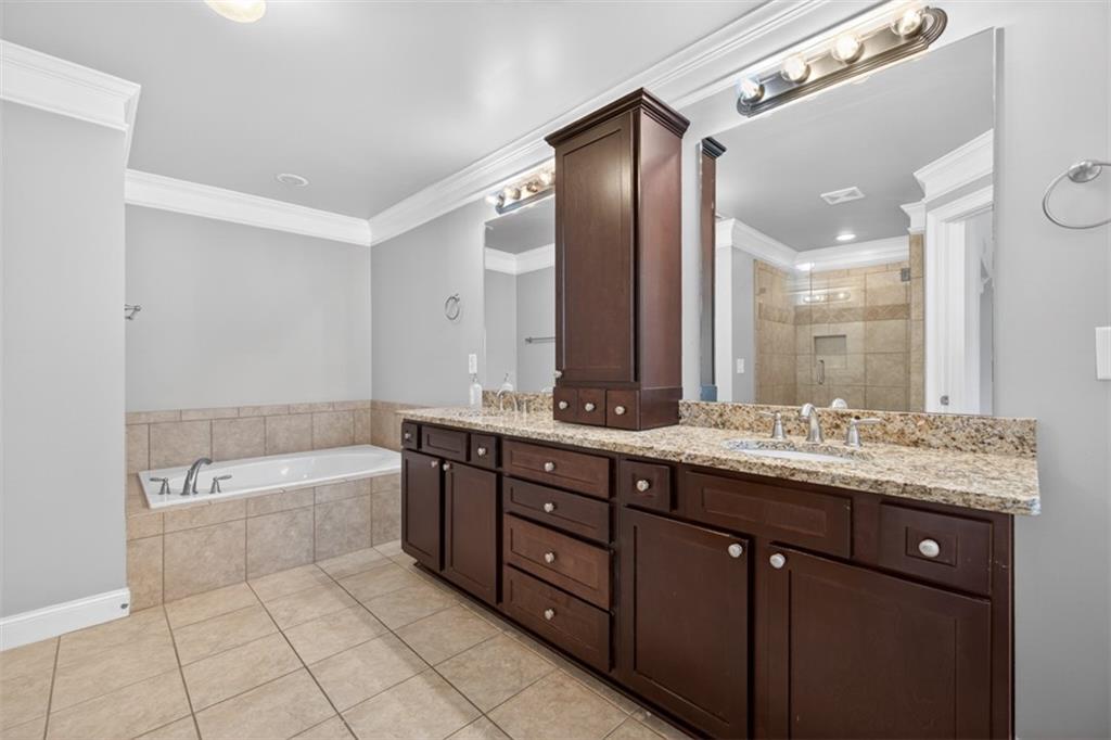 2854 Jordan Oaks Lane, Unit 8 Decatur, GA 30033 - Photo 21 of 41 a bathroom with a granite countertop bathtub sink double and mirror