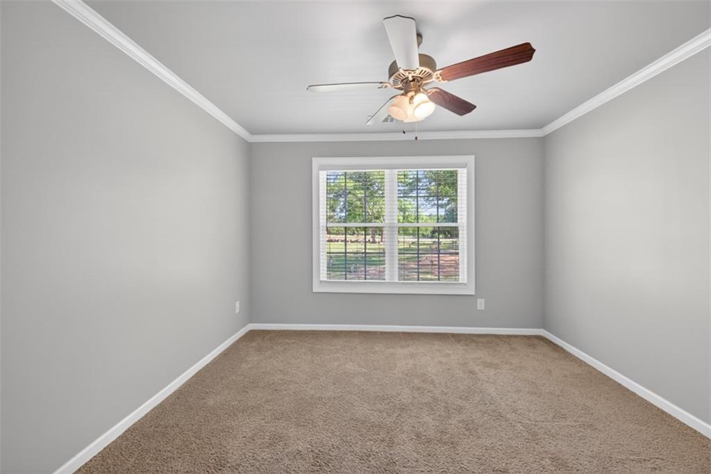 2854 Jordan Oaks Lane, Unit 8 Decatur, GA 30033 - Photo 26 of 41 a view of a livingroom with a ceiling fan and window
