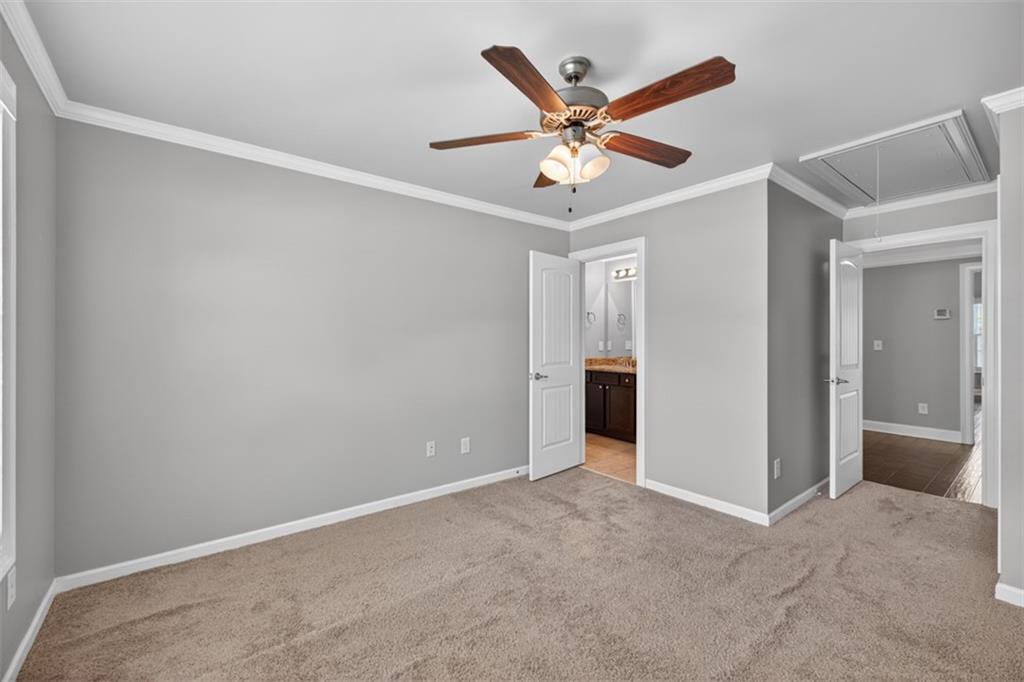 2854 Jordan Oaks Lane, Unit 8 Decatur, GA 30033 - Photo 27 of 41 a view of a big room with a chandelier fan and closet area