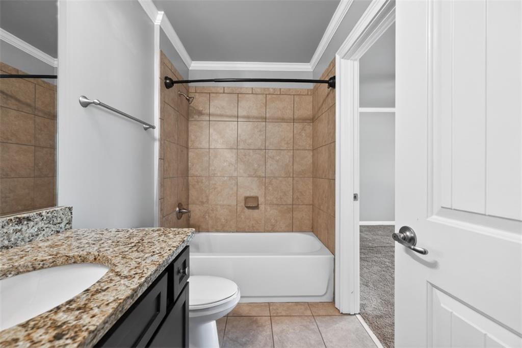 2854 Jordan Oaks Lane, Unit 8 Decatur, GA 30033 - Photo 29 of 41 a bathroom with a granite countertop sink toilet and shower