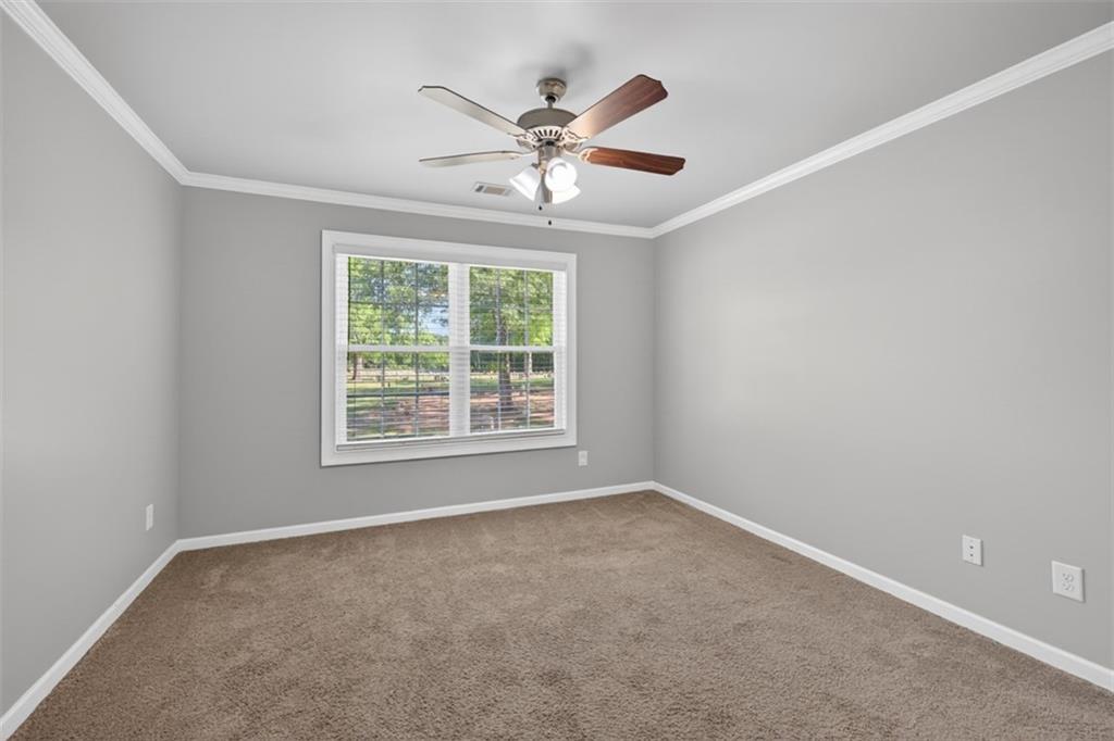 2854 Jordan Oaks Lane, Unit 8 Decatur, GA 30033 - Photo 30 of 41 a view of an empty room with a window