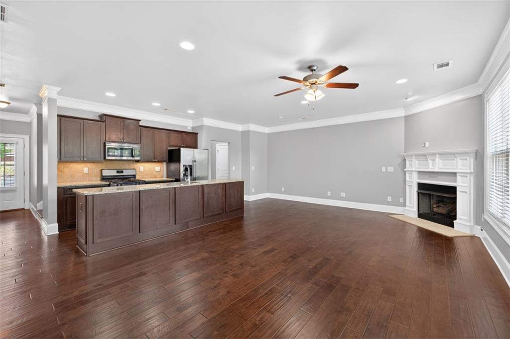 2854 Jordan Oaks Lane, Unit 8 Decatur, GA 30033 - Photo 4 of 41 a view of kitchen with cabinets and wooden floor