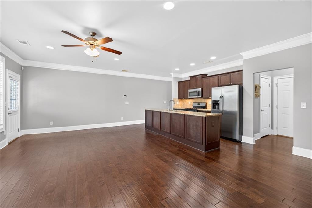 2854 Jordan Oaks Lane, Unit 8 Decatur, GA 30033 - Photo 7 of 41 a kitchen with stainless steel appliances granite countertop a refrigerator and a sink