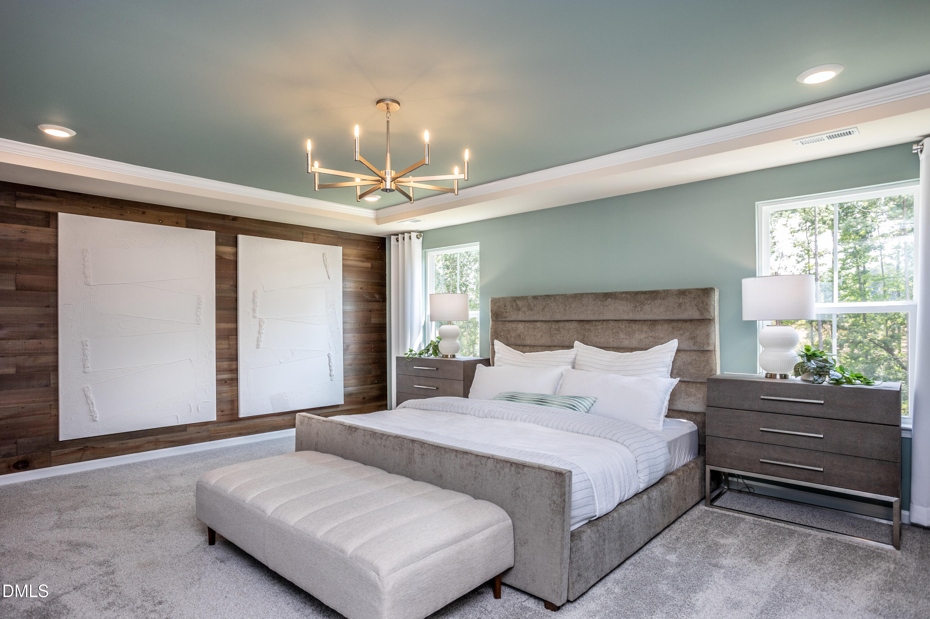 636 Fosterton Cottage Way Raleigh, NC 27603 - Photo 12 of 29 a bedroom with a large bed and a chandelier