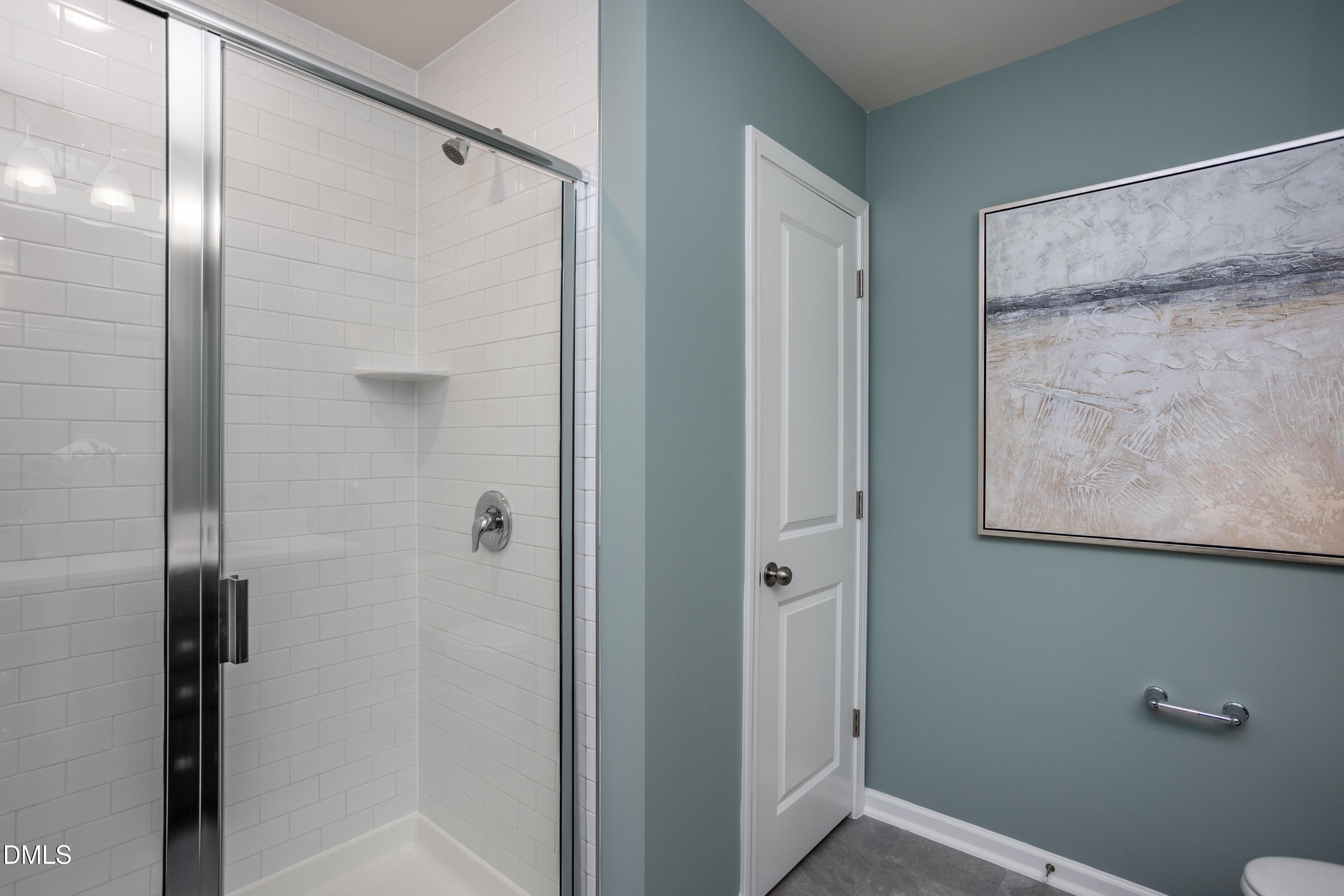 636 Fosterton Cottage Way Raleigh, NC 27603 - Photo 14 of 29 a bathroom with a shower and a glass door
