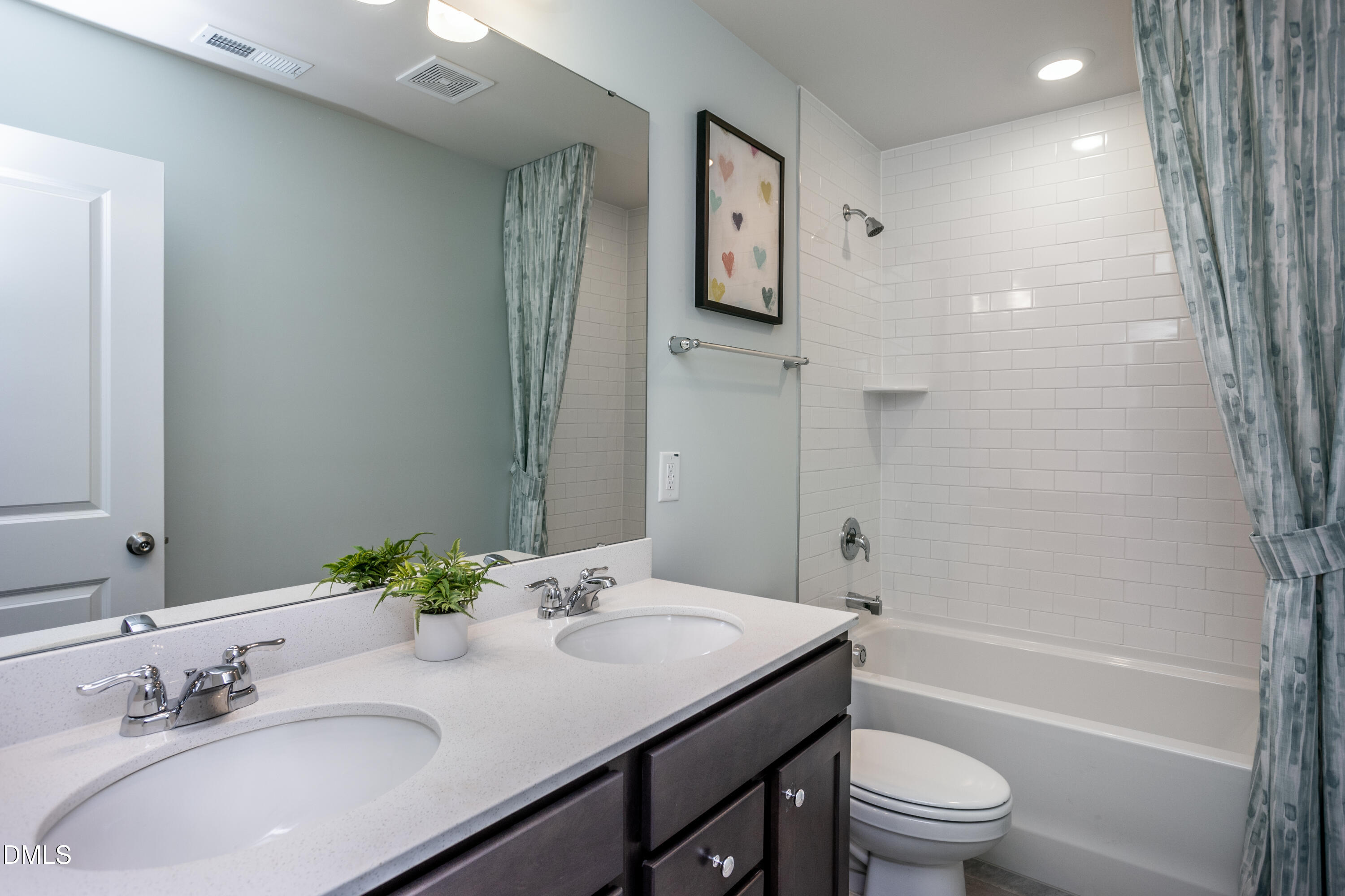 636 Fosterton Cottage Way Raleigh, NC 27603 - Photo 17 of 29 a bathroom with a granite countertop sink a toilet and shower
