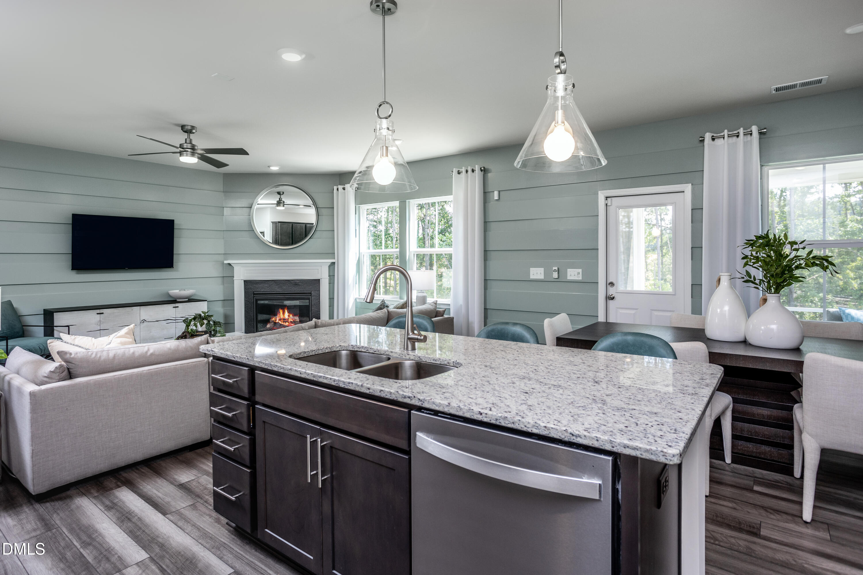 636 Fosterton Cottage Way Raleigh, NC 27603 - Photo 6 of 29 a kitchen with a center island and living room