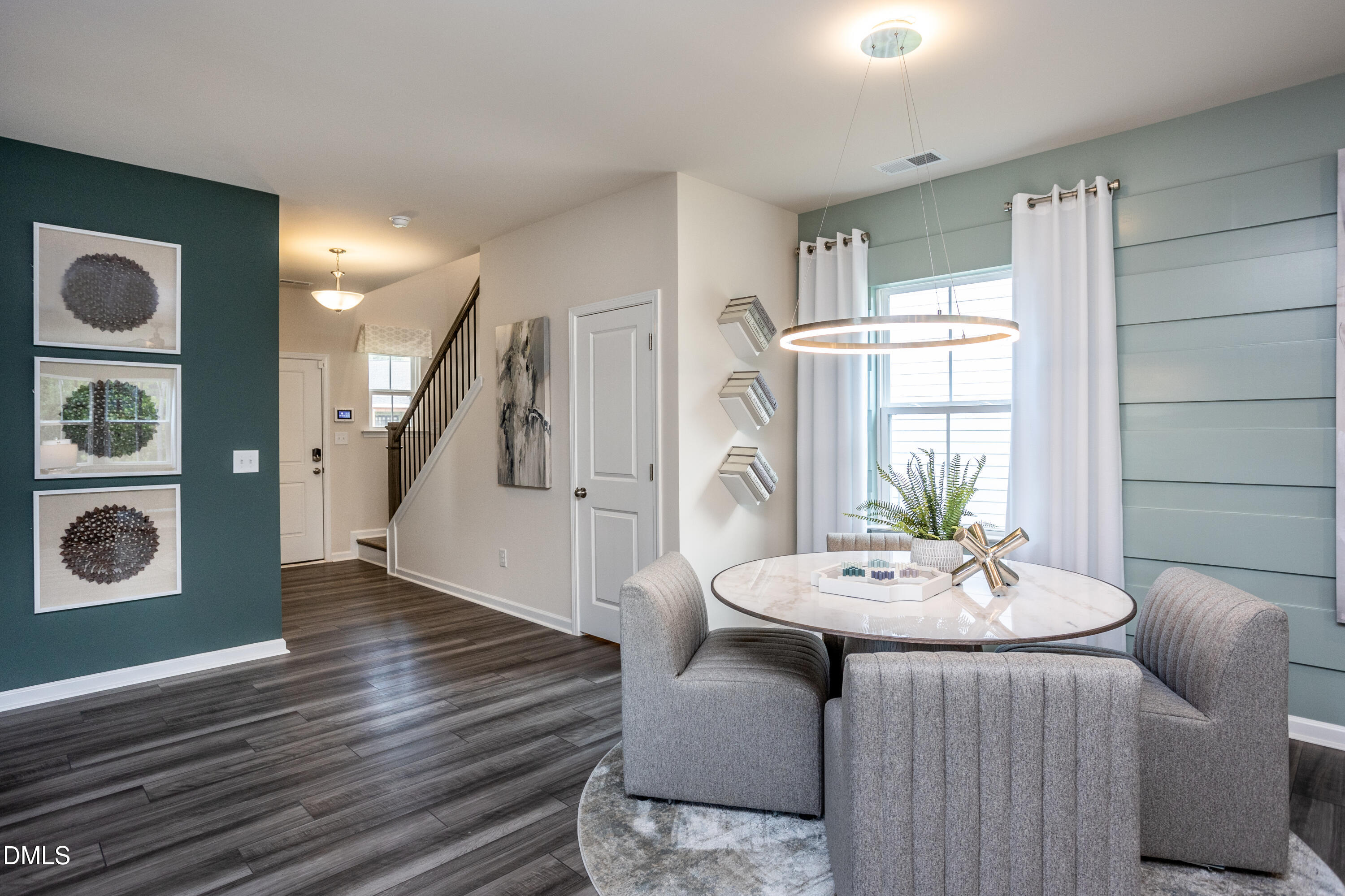 636 Fosterton Cottage Way Raleigh, NC 27603 - Photo 7 of 29 a living room with furniture and a table