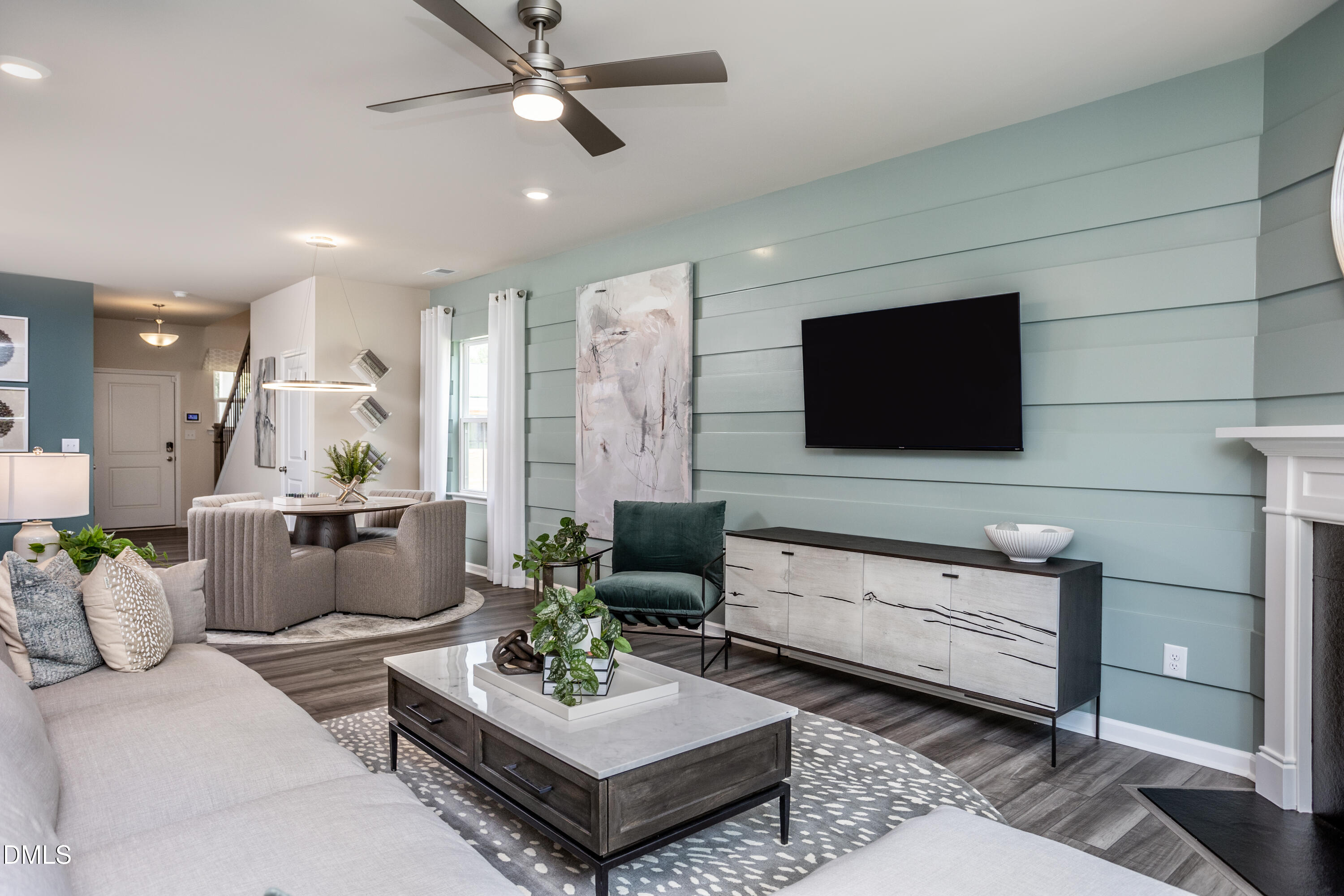 636 Fosterton Cottage Way Raleigh, NC 27603 - Photo 9 of 29 a living room with furniture and a flat screen tv