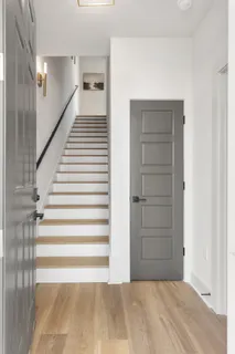 a view of a hallway with stairs