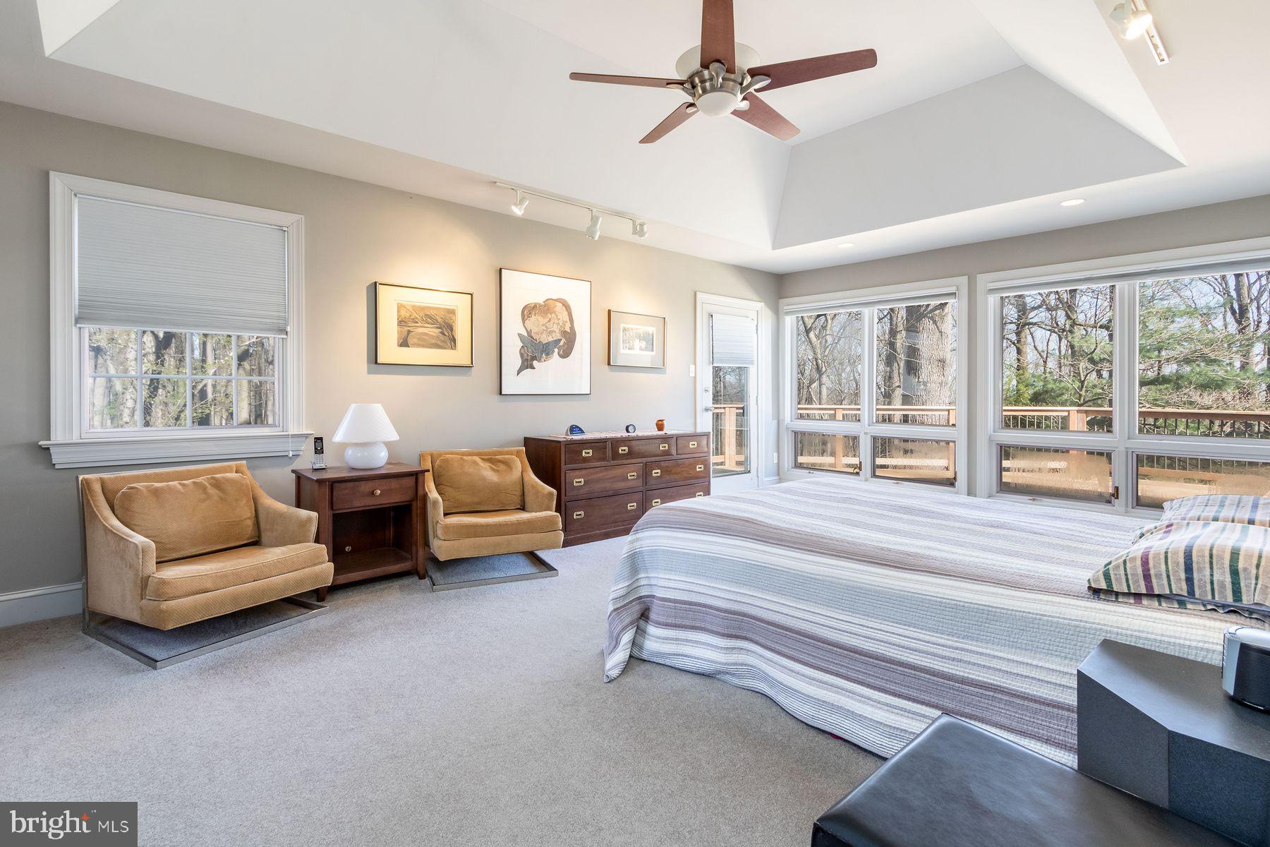 20 Solebury Mountain Road New Hope, PA 18938 - Photo 24 of 43 a spacious bedroom with a bed a couch and a window