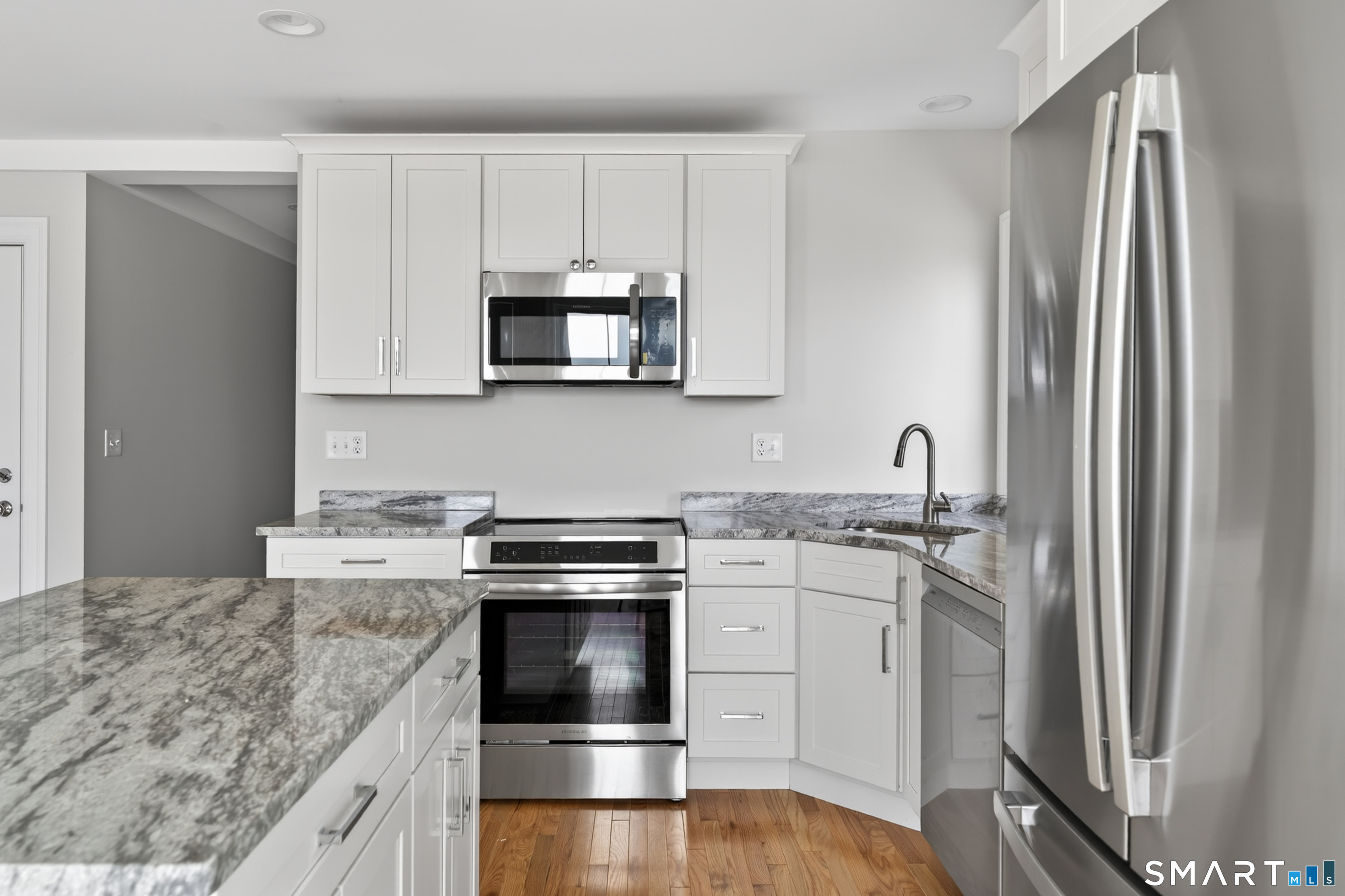 138 Bank Street, Unit 2A New London, CT 06320 - Photo 11 of 22 a kitchen with appliances cabinets and a counter top space
