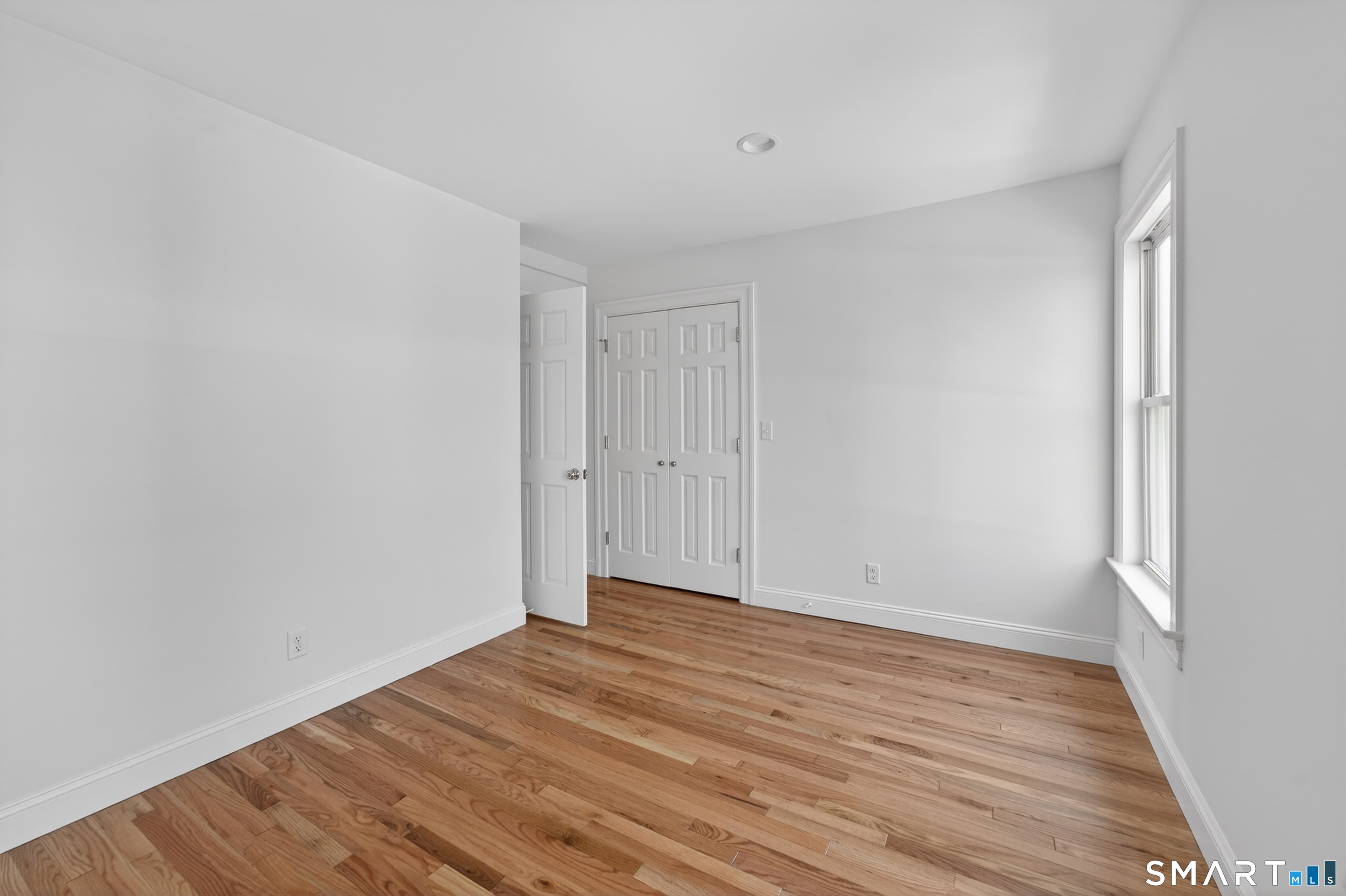 138 Bank Street, Unit 2A New London, CT 06320 - Photo 22 of 22 a view of room with wooden floor