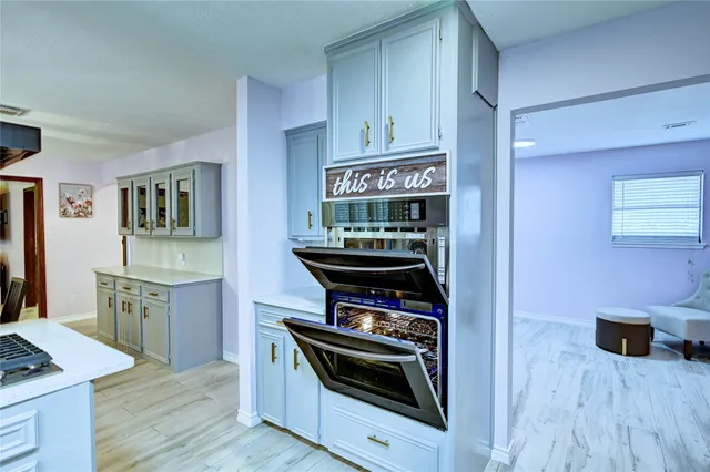 a kitchen with stainless steel appliances a stove and a refrigerator
