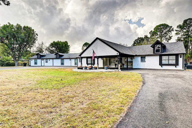 a house with swimming pool in front of it