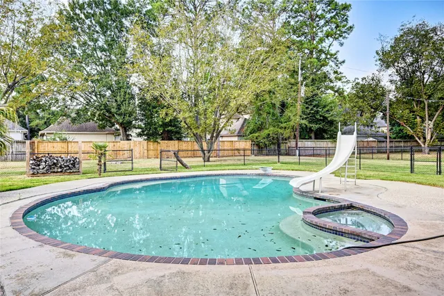 a view of a swimming pool with a sitting area