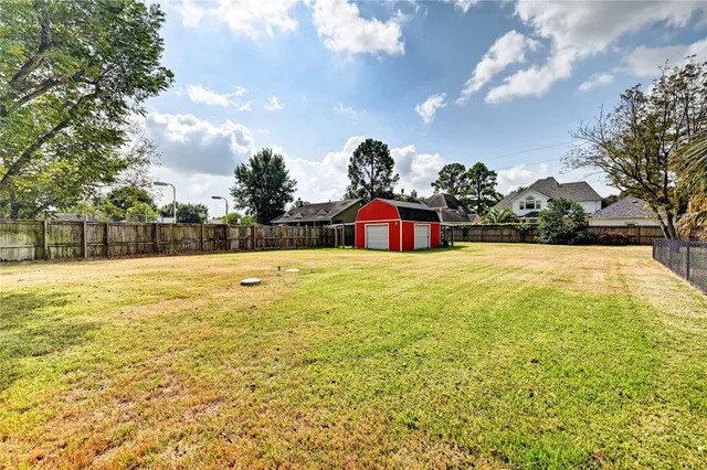 a view of swimming pool with table and chairs