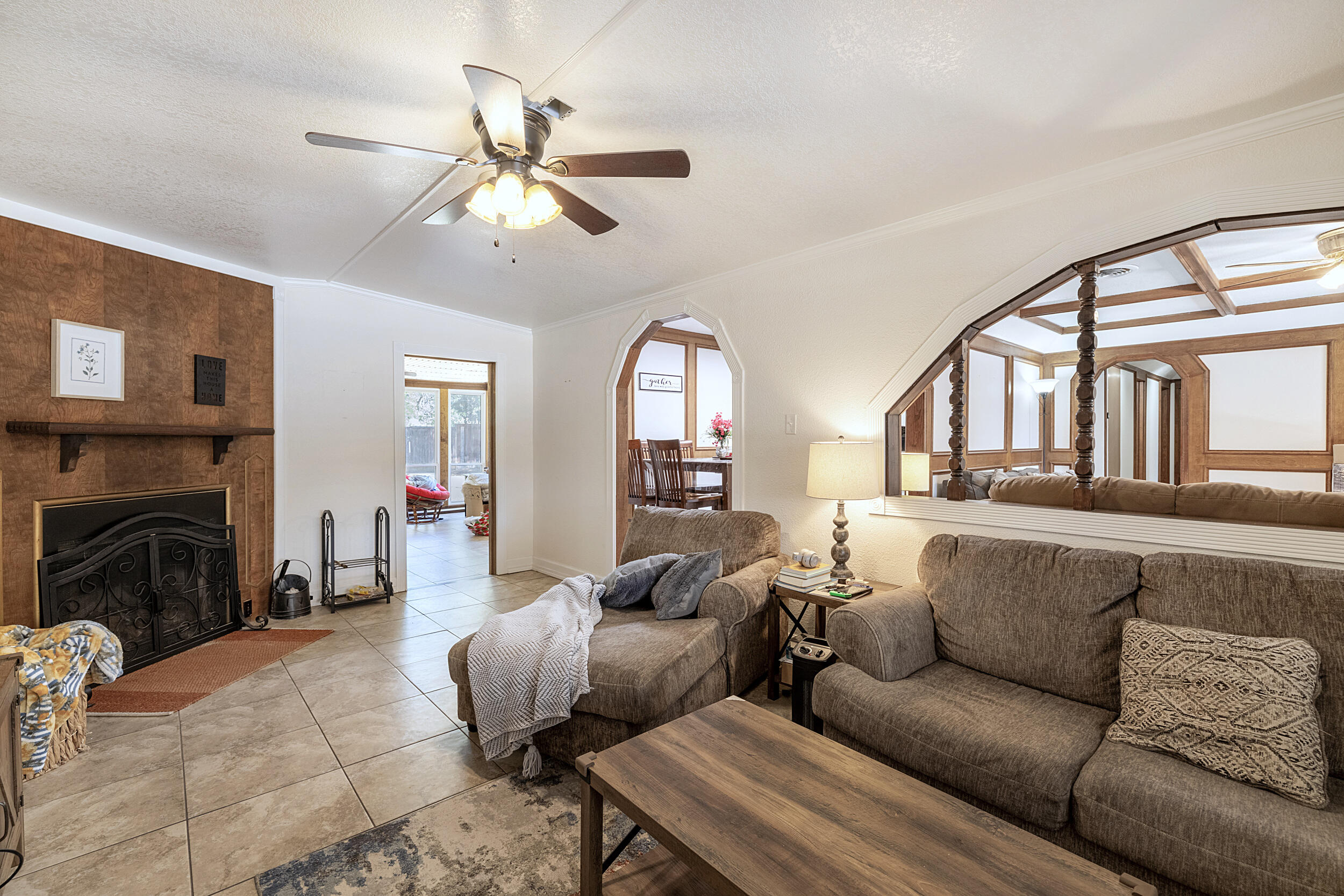 4210 44th Street Lubbock, TX 79413 - Photo 11 of 28 a living room with furniture and a fireplace
