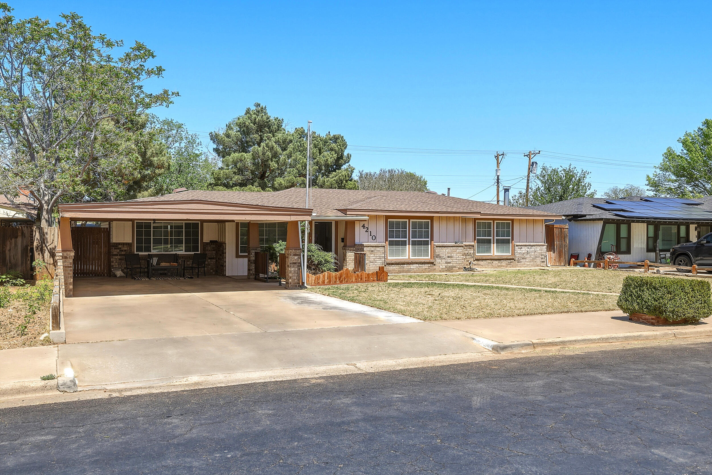 4210 44th Street Lubbock, TX 79413 - Photo 2 of 28 a front view of a house with a yard