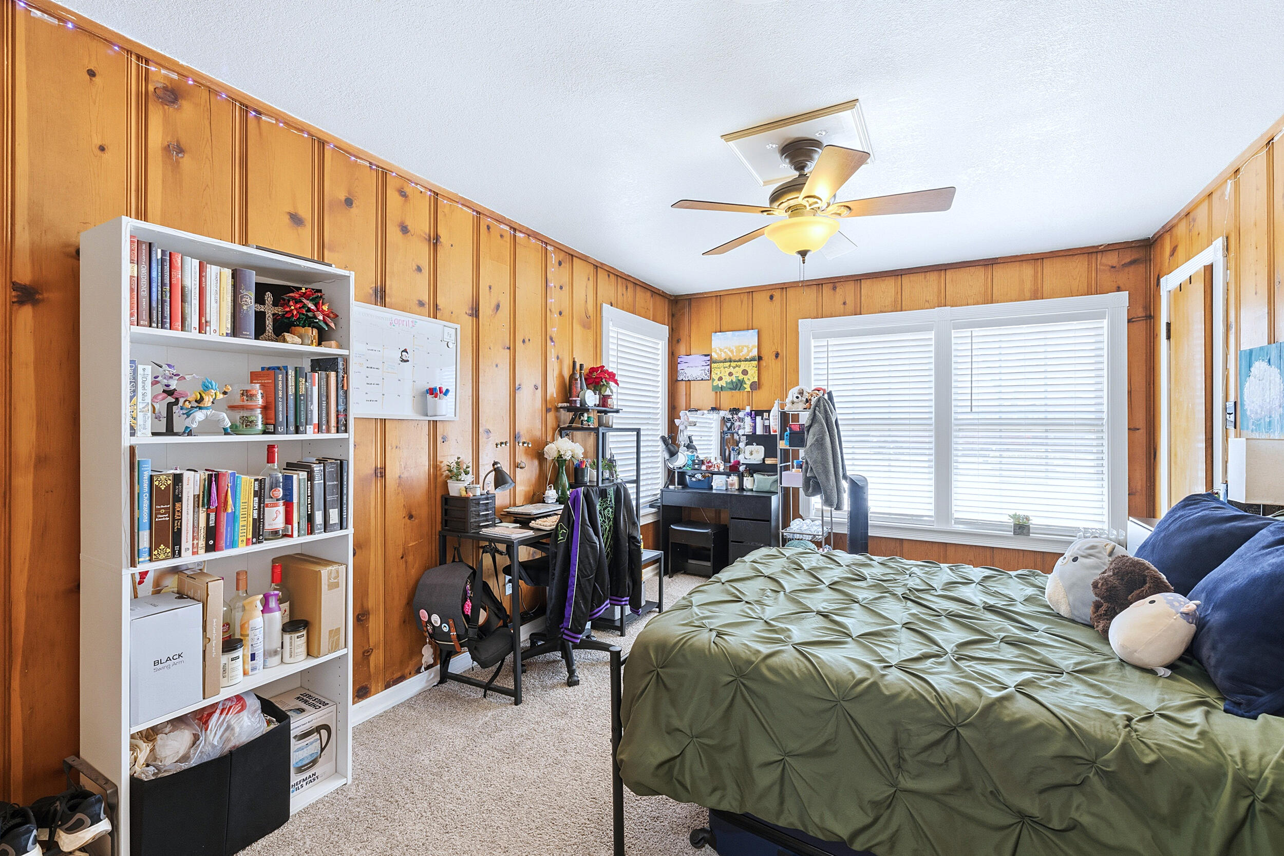 4210 44th Street Lubbock, TX 79413 - Photo 21 of 28 a bedroom with furniture and a large window